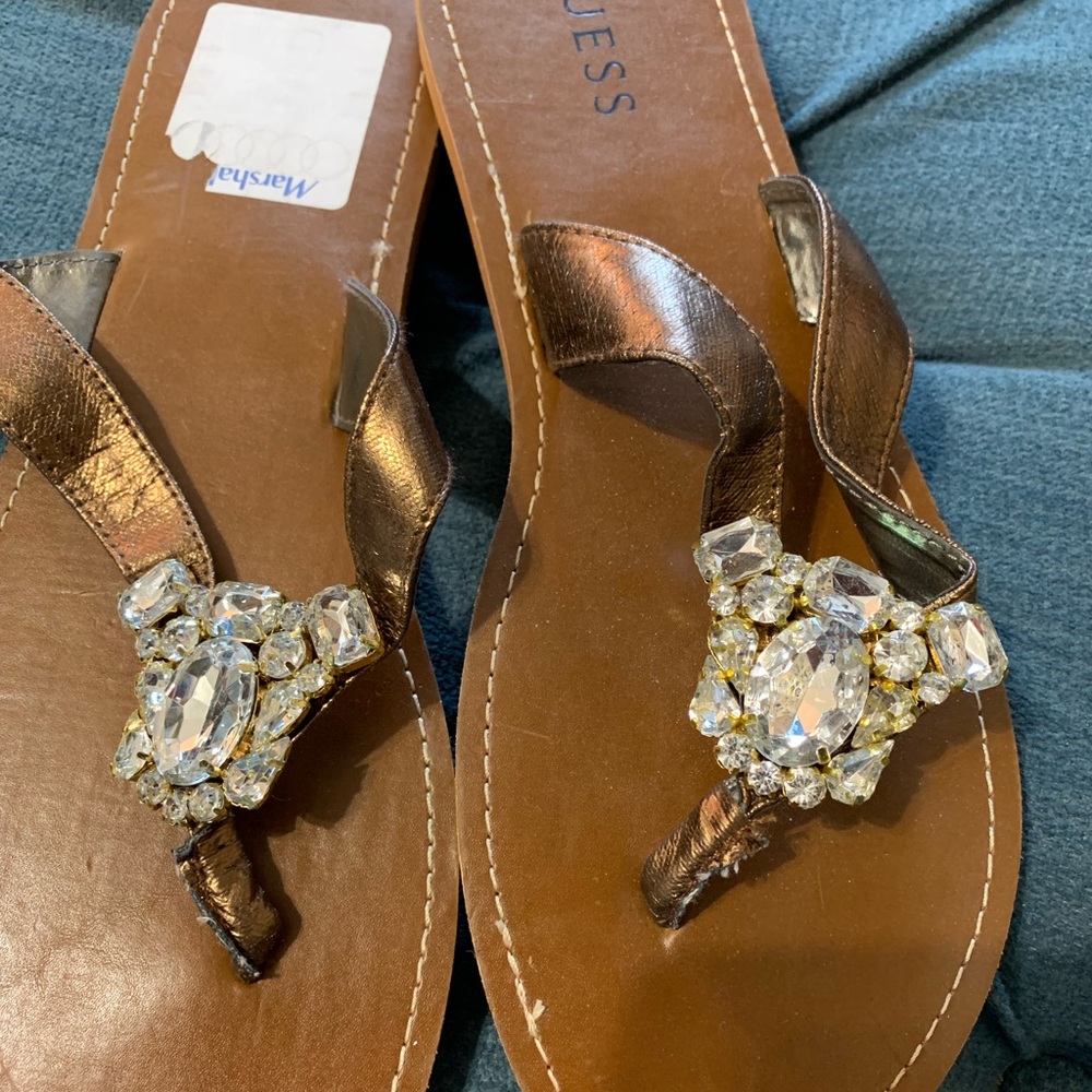 Guess Rhinestone bronze flip flops. 9M